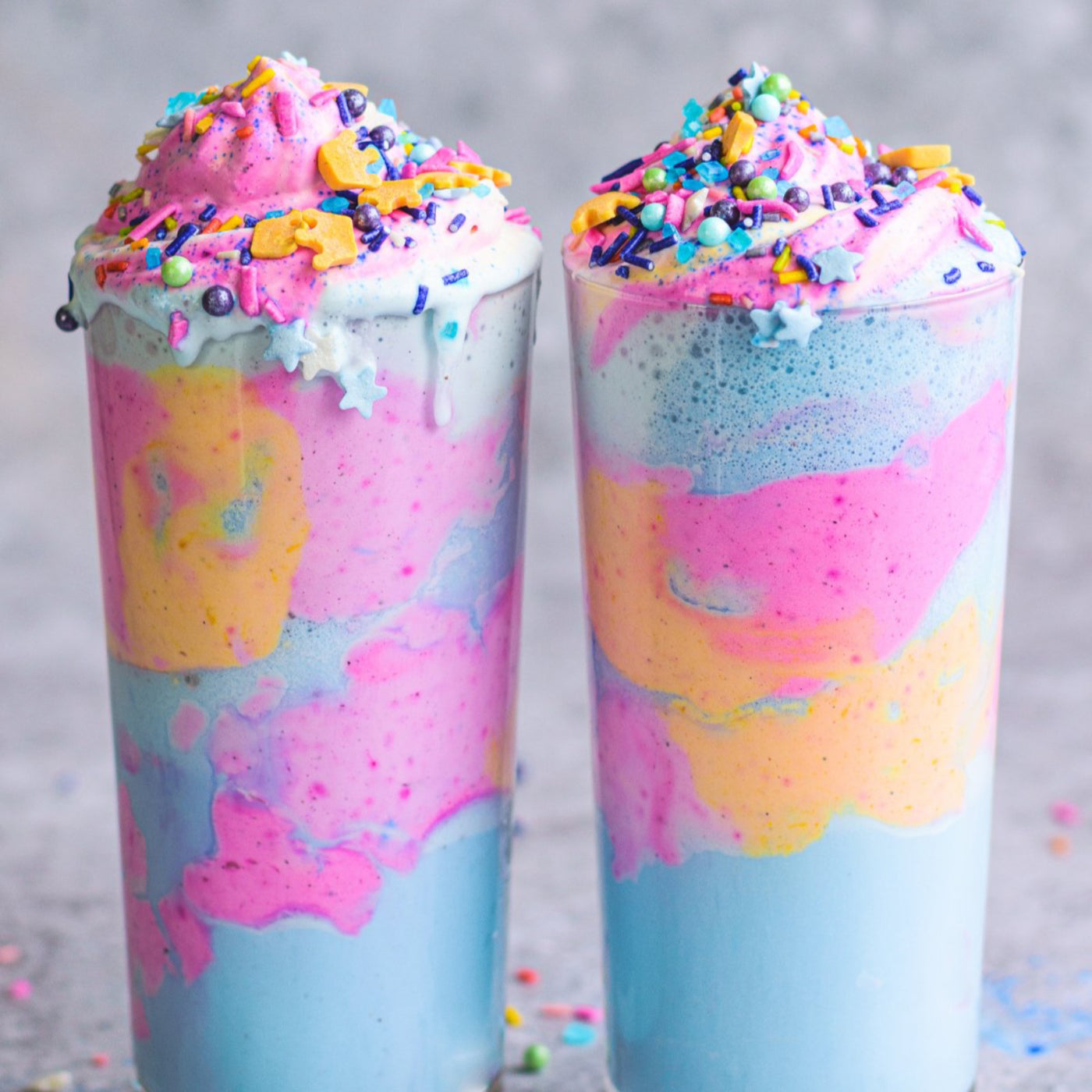 Unicorn shakes with pink pitaya blue spirulina and cur cumin powders