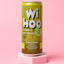 A can of WIHOO Energy Drink with Pineapple & Pear flavor, displayed against a pink background. The can is green with white and yellow text, and an illustration of a mushroom called Lion's Mane.